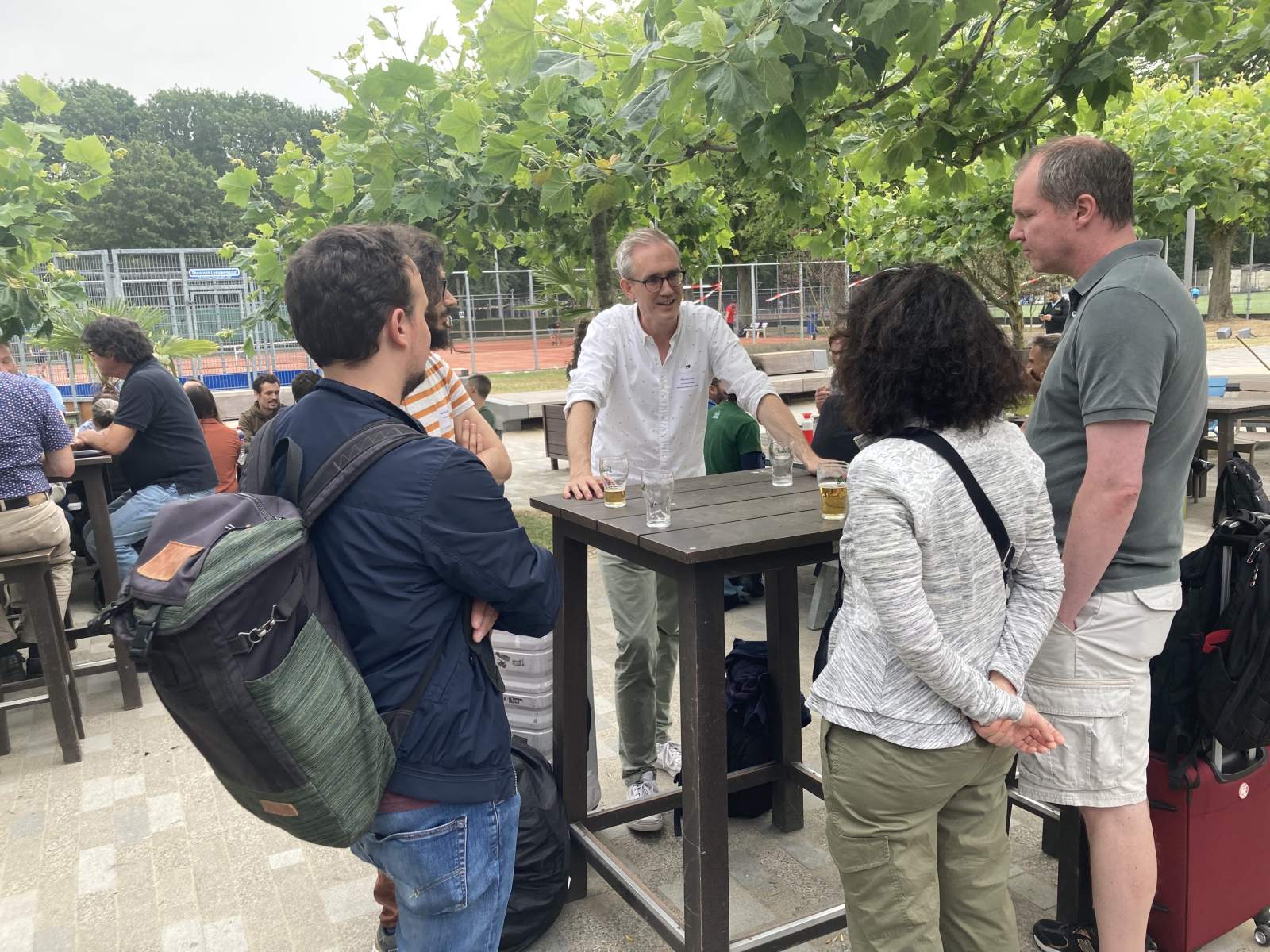 Participants enjoying drinks before the BBQ.